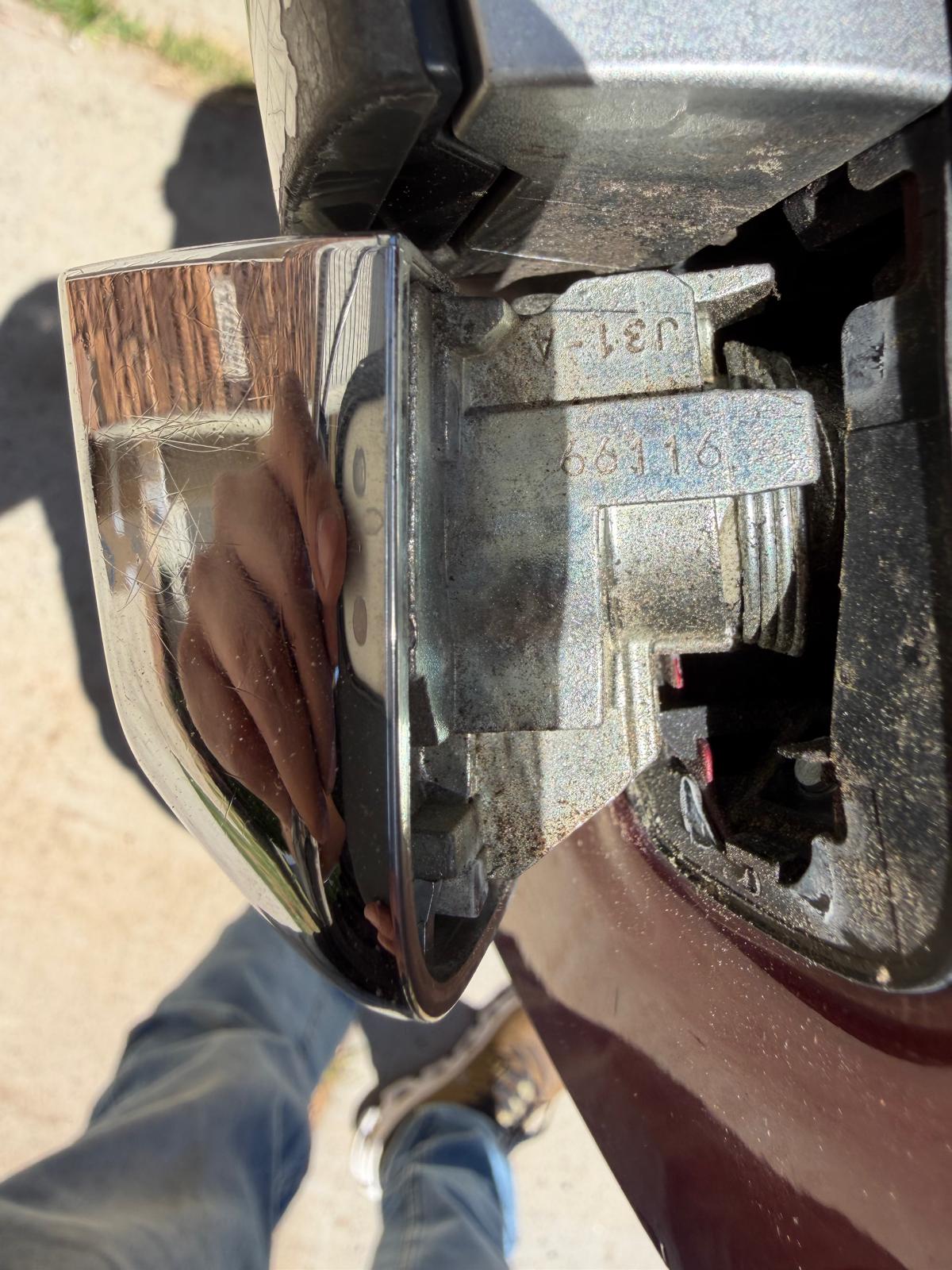 Close-up of a car door handle cylinder lock showing lock code digits for professional key replacement in Charlotte, NC NC